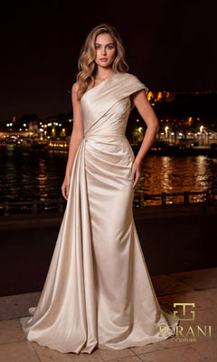 A woman in the Terani 261M6411 long formal dress stands outdoors at night by a waterfront, city lights twinkling in the background.