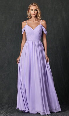 A woman wears the Juliet 262 long prom dress, a floor-length, light purple A-line gown with off-the-shoulder straps, standing against a dark, textured background.