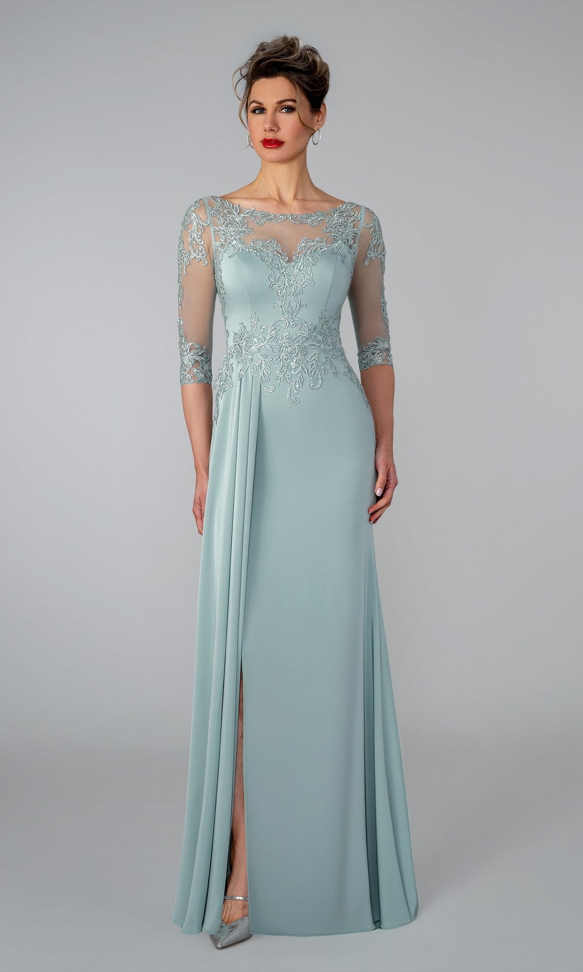 Stella Couture 26301 sage long formal dress featuring a bodice with lace appliques, sheer three-quarter sleeves, and a floor-length silhouette.