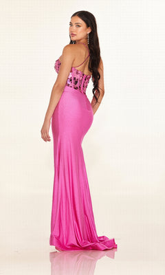 A woman poses in the Cecilia Couture 2630 long prom dress—a floor-length pink gown with a floral corset bodice and spaghetti straps—against a plain light background.