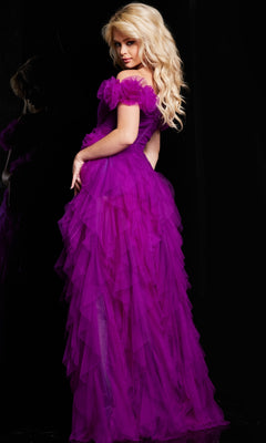 A woman with long blonde hair poses in the Jovani Ruffled Off-Shoulder Long Prom Dress 26312, a layered purple tulle formal gown with an elegant a-line silhouette, set against a black background.
