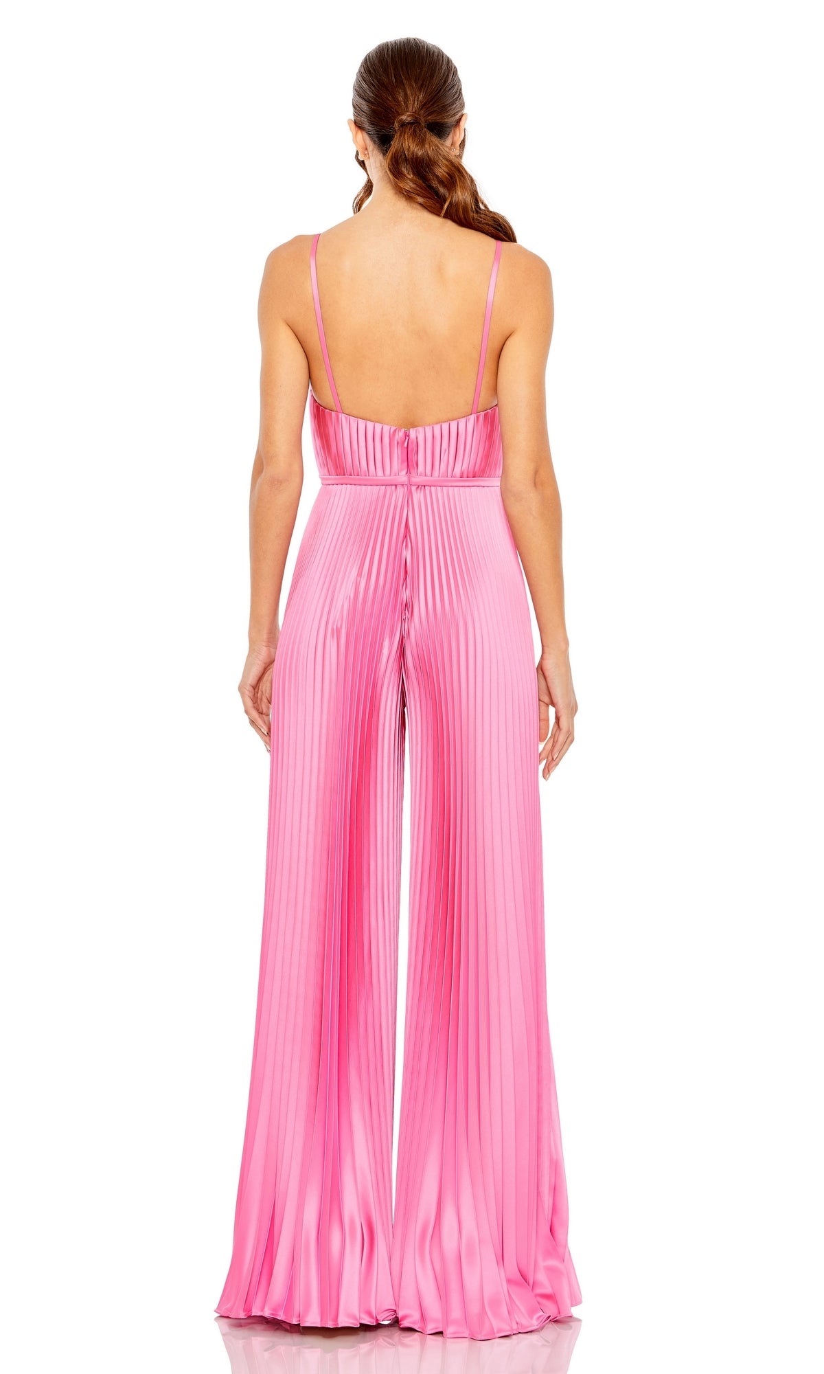 A woman stands with her back to the camera, wearing the Mac Duggal Pleated Wide-Leg Formal Jumpsuit 26319—a sleeveless, shiny pink outfit featuring allover pleats and wide legs.