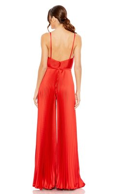 Woman stands with her back to the camera, wearing the Mac Duggal Pleated Wide-Leg Formal Jumpsuit 26319 featuring pleats, wide legs, thin straps, and a low back.