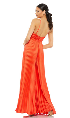Woman wearing the Mac Duggal Pleated Wide-Leg Formal Jumpsuit 26319, featuring a floor-length, sleeveless pleated orange design with thin straps, stands with her back turned and head looking over her shoulder.