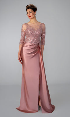 Stella Couture 26320 rose-colored evening gown with a sheer, beaded lace bodice, three-quarter sleeves, and a draped skirt with a high slit.