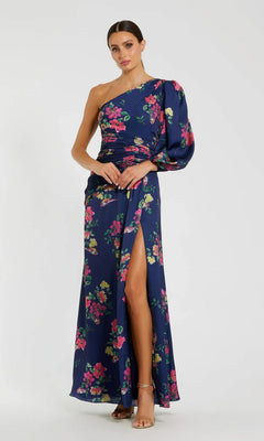 Woman models the Mac Duggal 2634 Plum Floral Long Formal Dress, featuring a one-shoulder design, puff sleeve, floral print, and thigh-high slit—a modern twist on the classic evening gown.