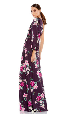 A woman models the Mac Duggal 2634 Plum Floral Long Formal Dress, featuring elegant pink and white accents, against a white background.