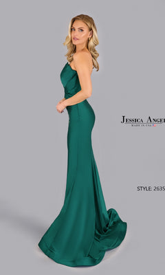 A woman models the Pleated Strapless Prom Gown by Jessica Angel (Style 2635), an emerald green fitted mermaid dress with a slight train, standing against a plain gray background. "Jessica Angel" and "Style: 2635" appear at the side.
