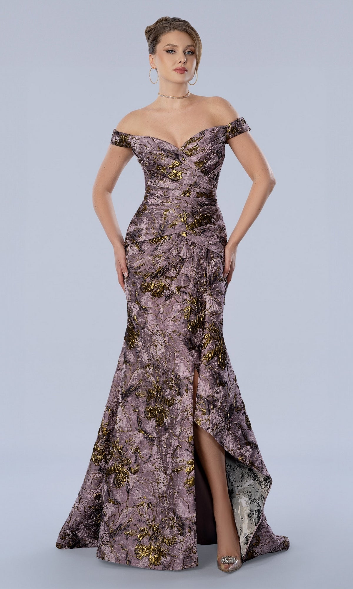 Stella Couture 26361 mauve off-the-shoulder mermaid dress with a gold floral pattern, a sweetheart neckline, and a side leg slit.