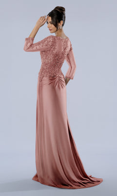 A woman wearing the rose-colored Stella Couture 26380 long formal dress, featuring a floor-length skirt and lace detailing on the bodice.