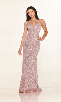 A woman wears the Cecilia Couture 2640, a floor-length, sleeveless light pink sequin prom dress with a deep V-neckline, thin straps, and an elegant open back, standing against a plain light backdrop.