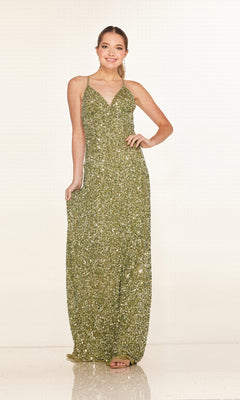 A woman poses against a plain light background in the Cecilia Couture 2640, a floor-length gold sequin prom dress featuring spaghetti straps and a v-neckline.