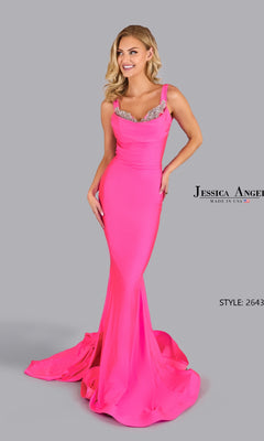 A woman wears the Jessica Angel 2643 Open-Back Long Prom Dress, a fitted bright pink mermaid gown with jeweled neckline details, standing against a plain gray background.