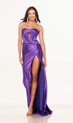 Woman wearing the Cecilia Couture 2643 Cut-Out Strapless Prom Gown, featuring a corset-style bodice and high slit, smiles against a plain white background.