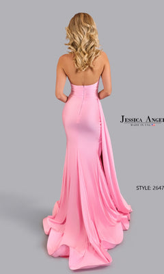 A woman with wavy blonde hair models the Jessica Angel 2647 Side Drape Halter Prom Gown, a fitted pink floor-length dress with a train, posed against a plain gray background.