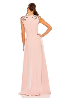 Woman wearing the Mac Duggal 26540 cap-sleeve long formal dress with floral embroidered shoulders stands with one hand on her hip, facing away from the camera.