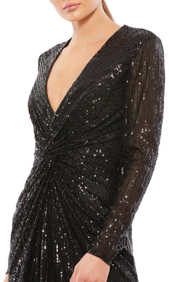 A person wearing the Mac Duggal Rose Gold Midi Sequin Party Dress 26549, featuring long sleeves, sequins, a deep V neckline, and gathered waist detail in a classic party-ready style.