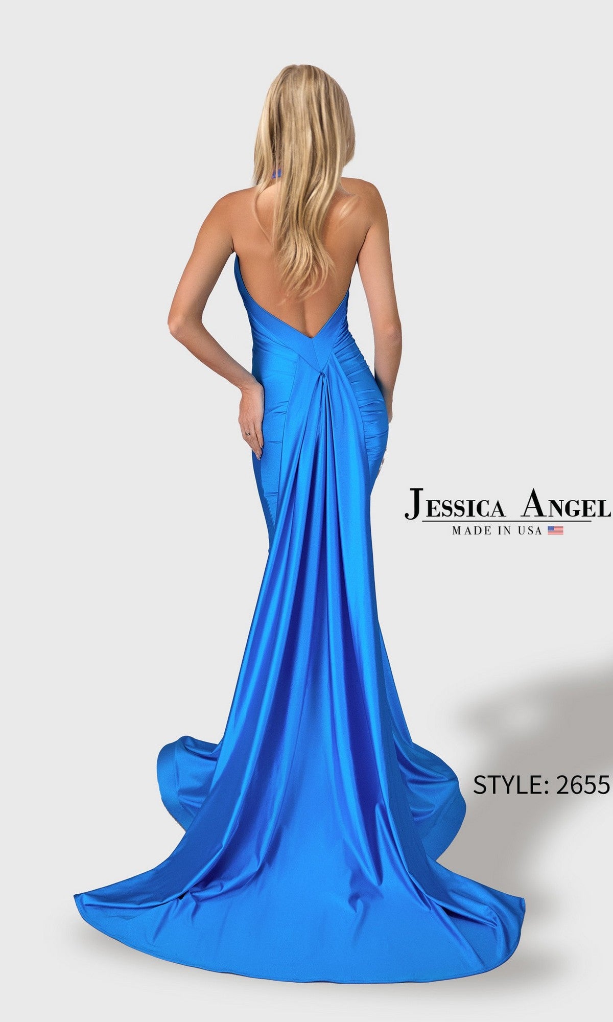 A woman with long blonde hair models the Jessica Angel 2655, a bright blue satin stretch mermaid prom dress featuring a halter neckline, backless design, and long train. Text reads “Long Prom Dress: Jessica Angel 2655.”.