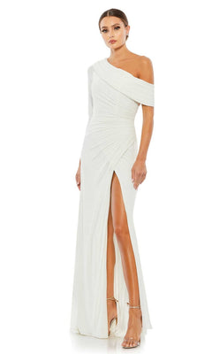 A woman in the Mac Duggal 26570 drop-shoulder long formal dress, featuring a white hue, thigh-high slit, and ruched detailing, paired with strappy high-heeled sandals.