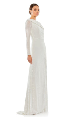 A woman stands in profile wearing the Mac Duggal 26571 One-Sleeve Sequin Formal Dress—a long, white gown adorned with shimmering sequins, featuring a single sleeve and a slight train.