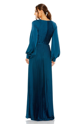 Woman in a teal Mac Duggal 26590 long sleeve formal dress stands facing away, elegantly displaying the pleated back of this modest prom gown.