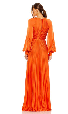 Woman models the Mac Duggal 26590, a pleated orange long formal dress with long sleeves, viewed from the back. Her low ponytail completes this chic and modest look—ideal for prom or any elegant occasion.