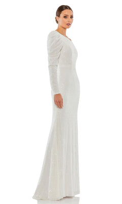 A woman stands sideways and looks at the camera, modeling the Mac Duggal 26591 One-Sleeve Sequin Formal Dress in floor-length white, against a plain white background.