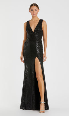 A woman in the Mac Duggal 26598 sleeveless black sequin formal dress with a deep V-neck, fitted waist, and high slit wears silver heels and stands against a plain background.