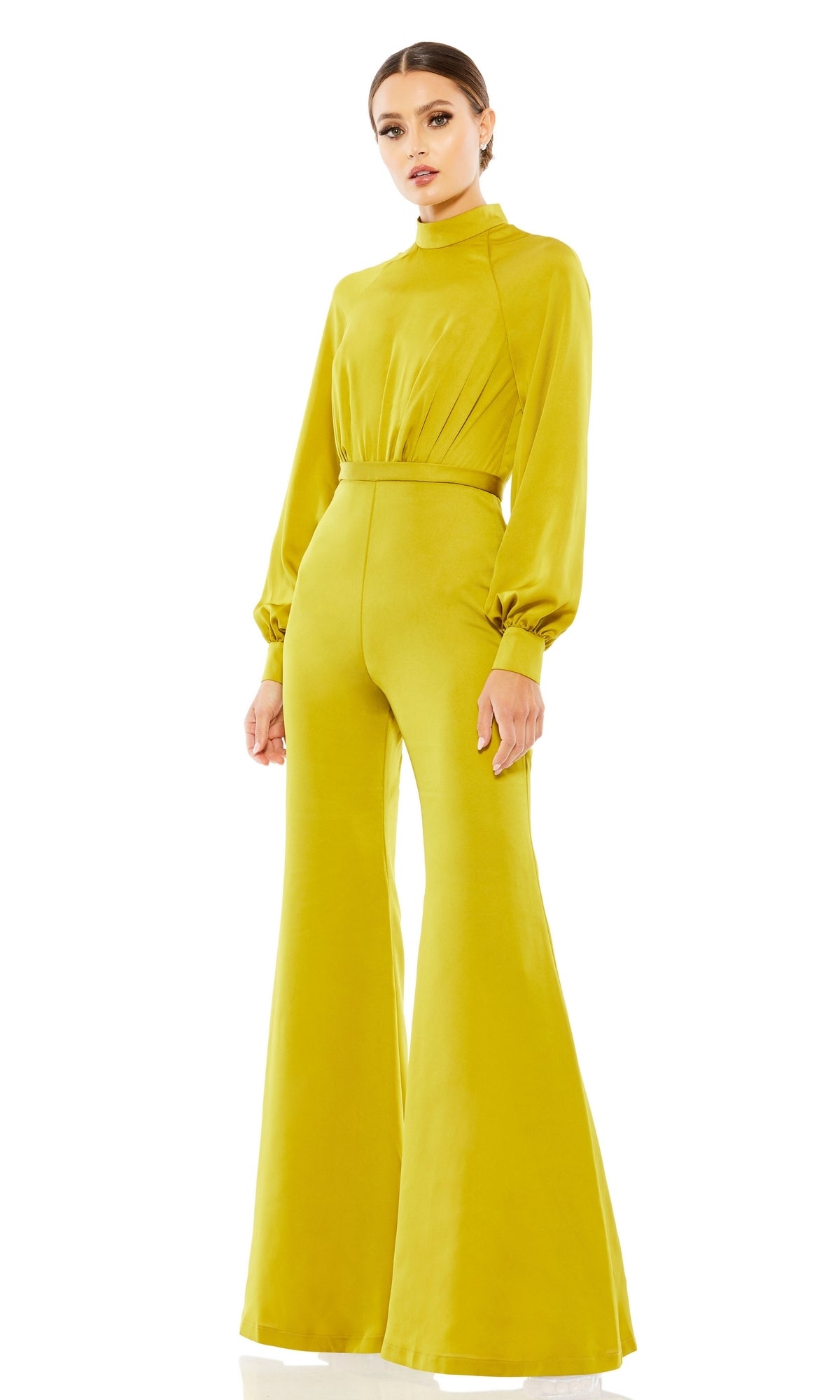 A person wears the Long Formal Jumpsuit 26685 by Mac Duggal, featuring chartreuse color, long sleeves, a high neck, and wide-leg pants, standing against a white background.