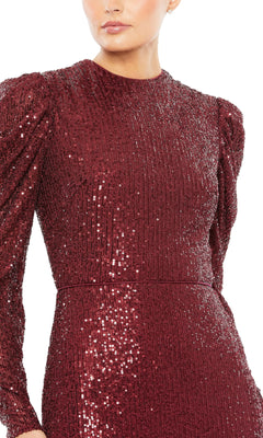 A person wearing the Mac Duggal 26692 long-sleeve, dark red sequin formal dress with a high neckline. Image is cropped at the shoulders and above the knees.