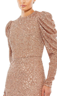 A person wears the Mac Duggal 26692 Long-Sleeve Sequin Formal Dress in rose gold with puffed shoulders, shown from the waist up against a white background.