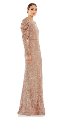 A woman stands against a white background wearing the Mac Duggal 26692 Long-Sleeve Sequin Formal Dress, featuring a floor-length fitted silhouette and subtle puffed shoulders.