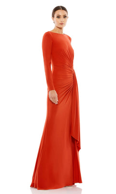 A woman stands against a plain white background wearing the Long Formal Dress 26714 by Mac Duggal, an orange floor-length gown with long sleeves and draped waist detailing.