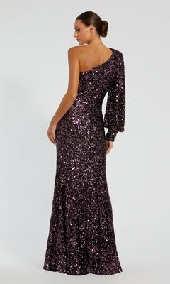 A woman models the Mac Duggal 26717 One-Sleeve Sequin Formal Gown, a floor-length purple dress with a single long sleeve, set against a plain background.