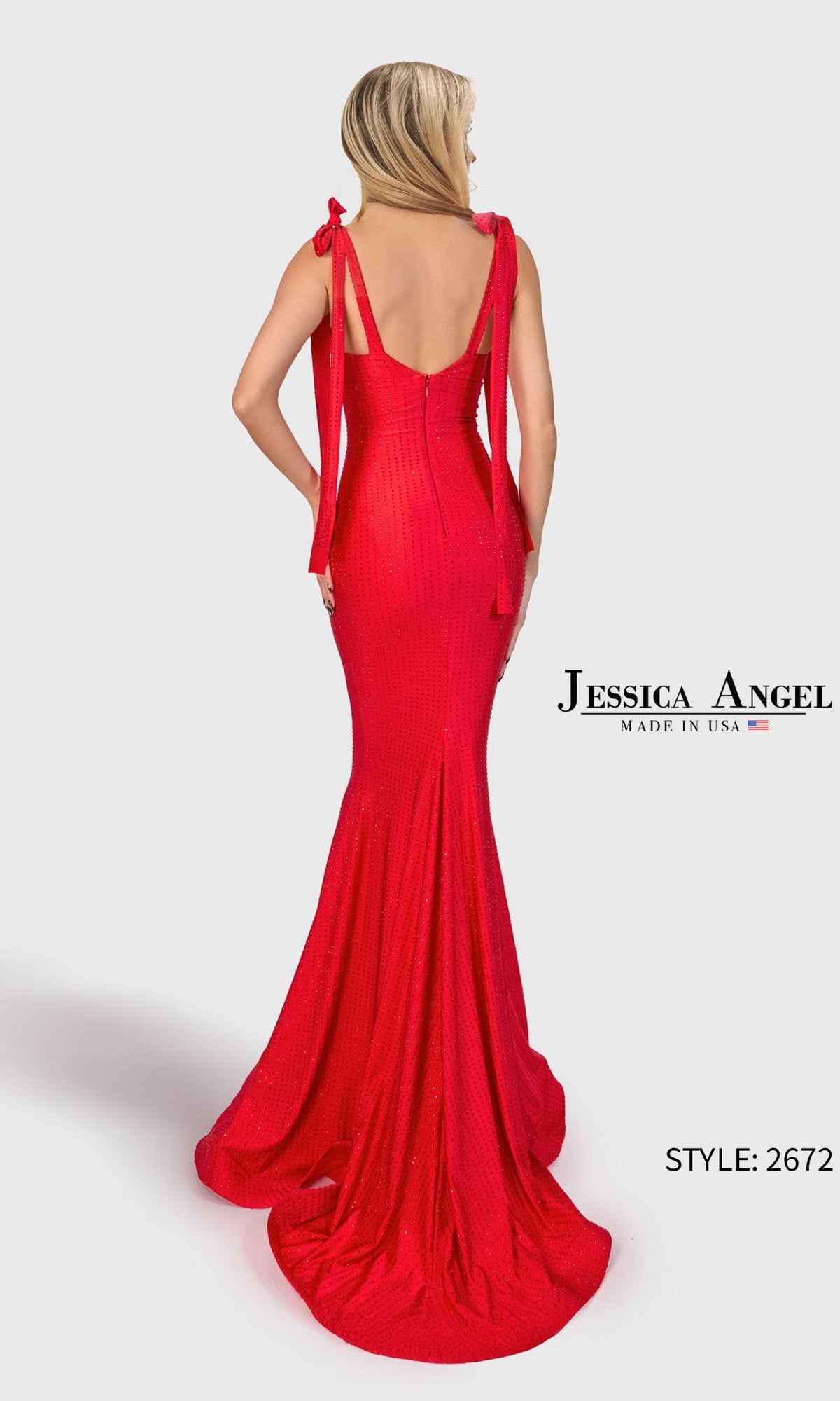 Woman models the Long Prom Dress: Jessica Angel 2672, a fitted red shimmering jersey gown with shoulder ties, shown from the back. Text: “Jessica Angel, Made in USA” and “Style: 2672.”.