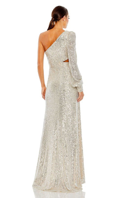 A woman in the Mac Duggal 26730 Cut-Out Long Sequin Formal Dress stands facing away, highlighting the shimmering back of this elegant gown.