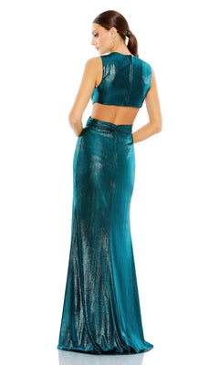 Woman wearing the Cut-Out Long Teal Formal Dress: Mac Duggal 26733, featuring a shiny metallic finish and back cutout, stands facing away against a white background.