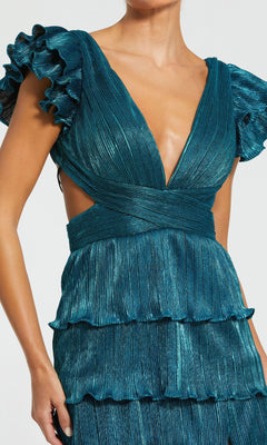 A person wearing the Mac Duggal Open-Back Tiered Formal Dress 26740: a teal, pleated long v-neck gown with flutter sleeves, ruffle details, side cutouts, and a stylish lace-up open back.