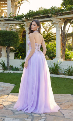 A woman stands outdoors on stone pavement in the Juliet JT2682A Long Prom Dress, featuring a strapless glitter design with a fitted, embellished bodice and flowing skirt. Lush greenery and columns are in the background.