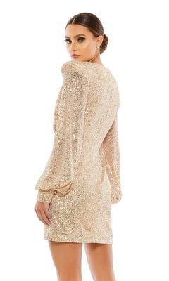 A woman poses with her back slightly turned, looking over her shoulder in a Long Sleeve Sequin Hoco Dress: Mac Duggal 26865, set against a plain white background.