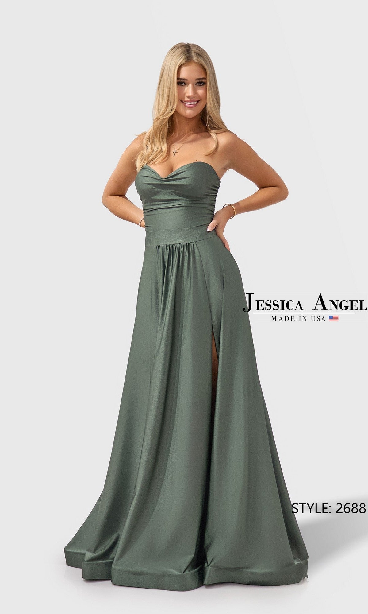 A woman wears the Long Prom Dress: Jessica Angel 2688 in Rust Olive, featuring a strapless satin jersey design with a high slit. She stands smiling against a plain white background. Text reads 