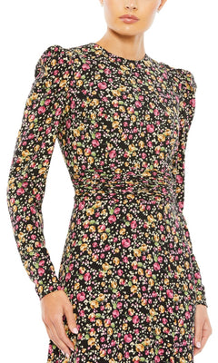 Someone is wearing the Long Formal Dress 26916 by Mac Duggal, a black formal gown featuring long sleeves, a fitted waist, and a vibrant multicolored floral print.