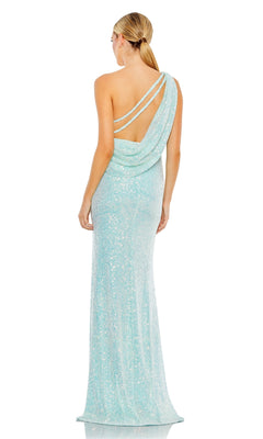 A woman stands with her back to the camera, wearing the Mac Duggal 26990 One-Shoulder Sequin Formal Gown in light blue, featuring dual straps and a draped open back.