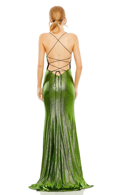 A woman with tied-back hair models the Mac Duggal 27061 Strappy-Back Metallic Prom Gown, showcasing its crisscross straps and open back while standing against a white background.