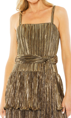 Woman wearing the Mac Duggal Tea-Length Metallic Party Dress 27062, a sleeveless gold pleated cocktail dress with a square neckline and matching sash belt—perfect for parties.