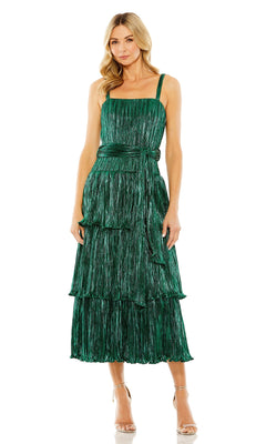 Woman wearing the Mac Duggal Tea-Length Metallic Party Dress 27062, a sleeveless green dress with a tiered skirt and belted waist, paired with nude heeled sandals.