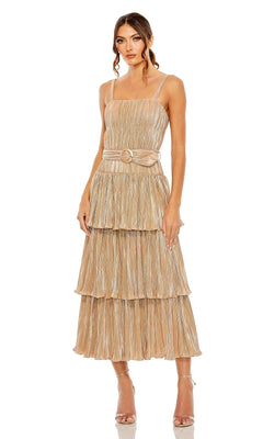 A woman stands against a plain white background in strappy heels, wearing the Mac Duggal Tea-Length Metallic Party Dress 27062, which features tiered pleats, thin straps, and a belt.