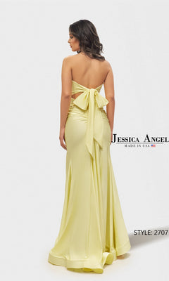 A woman wears the Long Prom Dress: Jessica Angel 2707, a strapless light yellow gown with a large back bow, posing against a white background. The text displays "Jessica Angel" and "STYLE: 2707".