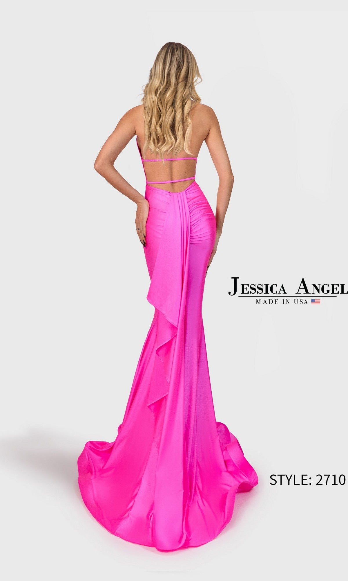 Model wearing the Jessica Angel 2710 long prom dress in bright pink with halter neckline, ruffle detail, and mermaid silhouette, standing against a white background.