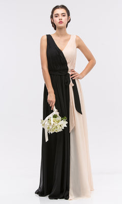 A woman holds a small bouquet while wearing the Eureka 2711, a sleeveless, floor-length two-toned black and beige chiffon formal dress with a V-neck and tied waist.